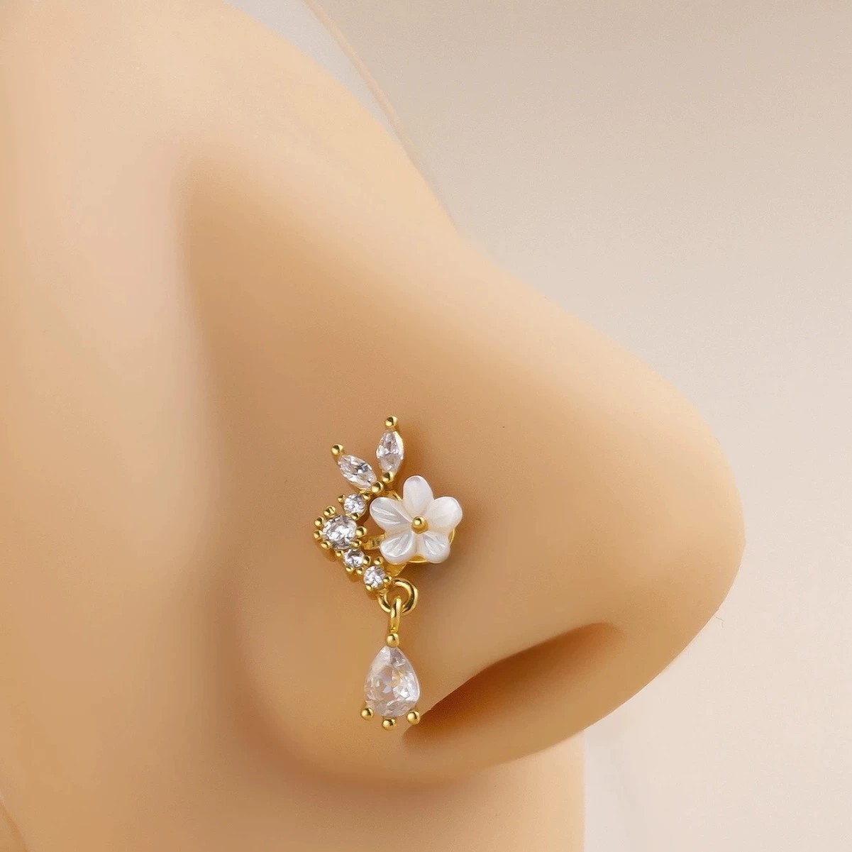 Gouden bloem neusring met hang - Body Jewelry Surgical Steel recensie en prijs